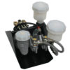 An abs brake module with attached fluid reservoirs, metal fittings, and electrical connections mounted on a black base plate.