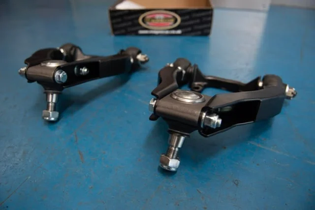 Pictured here are some of our rose jointed top wishbone arms. These are part of our Rose Joint Adjustable Top Wishbone Kit⁠
⁠
What's Included in the Kit:⁠
⁠
🔧 Rose jointed top wishbone arms⁠
🔧 Fixing bolts⁠
🔧 New top fulcrum pins⁠
🔧 Stainless steel spacers & top ball joints⁠
⁠
Key features include adjustability to any camber on either side, individual top wishbone arm adjustments of + or -0.75", and unlimited adjustment capability with no fixed camber setting.⁠
⁠
Note: For TR2-4 with early-type top wishbones, converting to 3-degree trunnions is necessary (available but not included in the kit). Please also note that top wishbones are exchange items with a surcharge applied if none are supplied. Exchange wishbones should be the later TR4A-6 type.